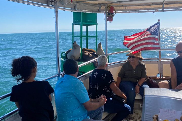a group of people on a boat in the water
