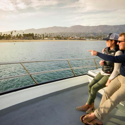 a person sitting next to a body of water